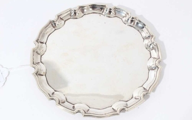 George V silver card tray of circular form with pie crust border, (Birmingham 1932), maker Cohen & Charles, all at 4oz, 15.5cm in diameter
