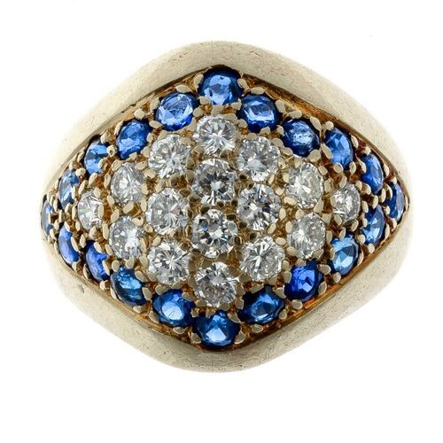 Gold ring set with a pavé of brilliants in a...