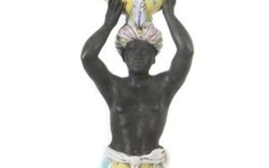 Great Moorish chandelier Probably Italy, second half of the 20th century, red, heavy shards in the style of Italian faience, polychrome paint, a man standing on a pedestal, wearing a short skirt and a sash strapped on top of it, a cloth wrapped around...