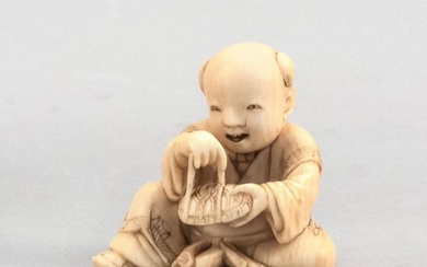 JAPANESE IVORY NETSUKE By Gyokuyosai Mitsuhina (1781-1868). In the form of a boy wrapping a cord around a turtle. Signed on base. He...