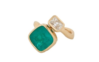 Lady's 18K Yellow Gold Emerald and Diamond Dinner Ring, with a cushion cut 4.63 carat emerald atop a