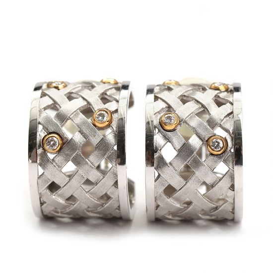 Ole Lynggaard: A pair of braided diamond ear clips set with numerous brilliant-cut diamonds, mounted in 14k gold and white gold. Diam. 2 cm. (2)