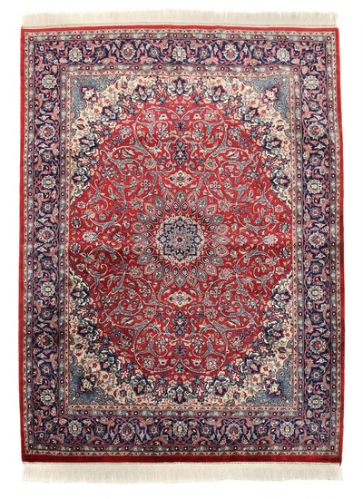Oriental rug, classic medallion design with ornaments, entwined branches, flowers and foliage on red base. 20th century. 233×169 cm.