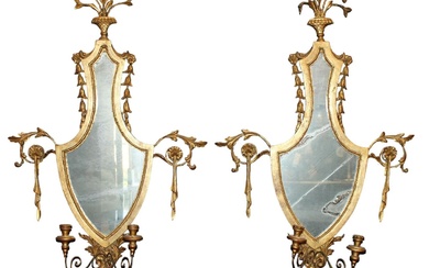 Pair of Italian gilt shield form mirrors with candle holders