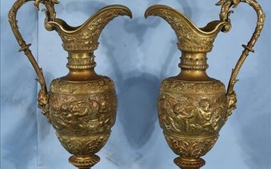 Pair of Victorian bronze ewers with cupids, 25 in. T.