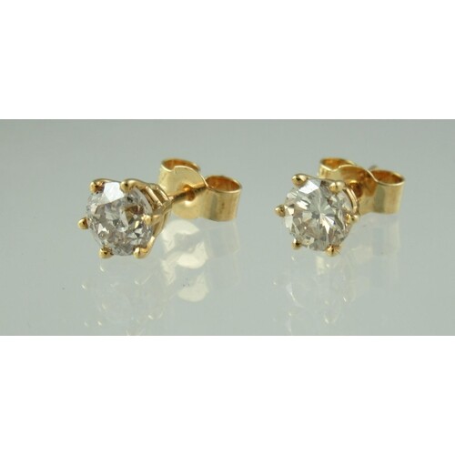 Pair of diamond solitaire earrings set in 18ct gold. Estima...