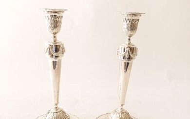 Pair of neoclassical torches, [17]95, chased silver, hallmarks, h. 29 cm, 751 g approx. [bobbins brought back].
