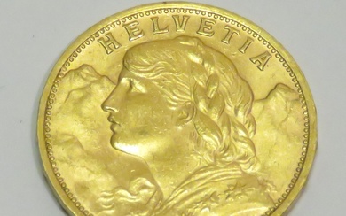 Pièce en or de 20 Francs "Helvetia" datée de 1935. Poids : 6g45. Diam :...