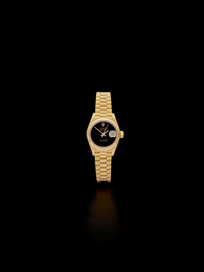 Rolex. A fine 18K gold lady's automatic calendar bracelet watch with oxyx dial