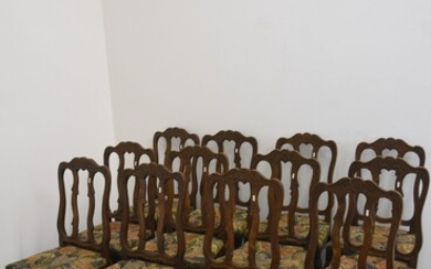 Série de 12 chaises de style Régence liégeoise en frêne sculpté