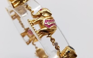 Superbe bracelet éléphant en or jaune 18 carats orné de diamants et de pierres précieuses....