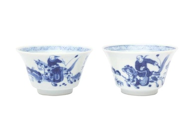 TWO CHINESE BLUE AND WHITE CUPS 清康熙 青花策馬勇戰圖盃兩件 《玉》款