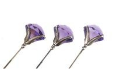 Three matching Art Nouveau silver and amethyst hat pins