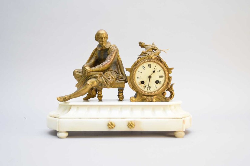 Two French bronze and marble figural mantel clocks