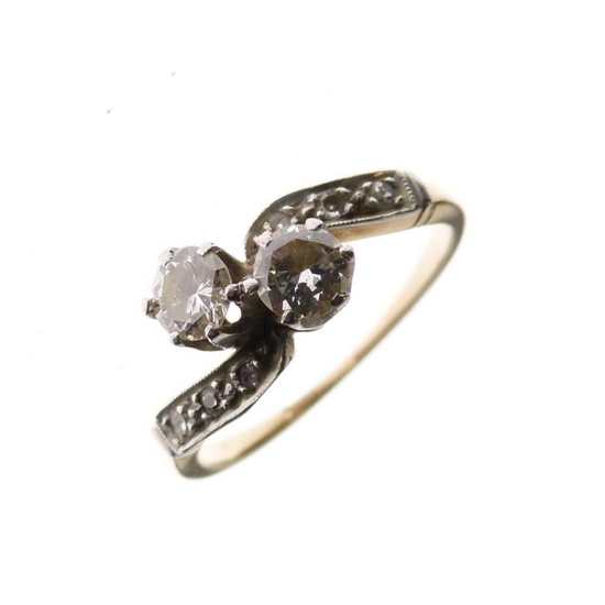 Unmarked yellow metal and diamond dress ring of crossover...