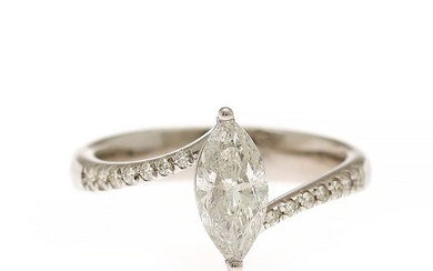 A diamond ring set with a marquise-cut diamond weighing app. 1.05 ct. flanked by numerous diamonds, mounted in 14k white gold. G/P2. Size 55.