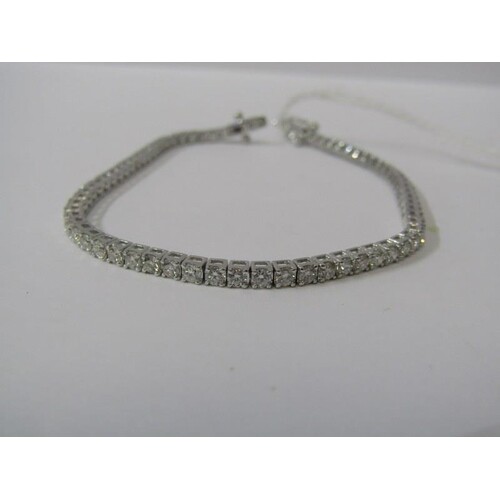 18ct WHITE GOLD DIAMOND LINE BRACELET, 3ct of well matched b...