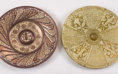 TWO HISPANO-MORESQUE POTTERY CHARGERS 1) Copper luster with central fleur-de-lis surrounded by a flower and wheat design. Diameter 1...
