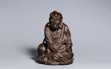A BAMBOO WOOD SCULPTURED ARHAT BUDDHA