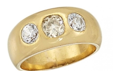 A diamond three stone gypsy ring, set...