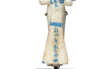 An Egyptian-style bichrome glazed faience shabti wearing...