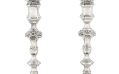 A pair of George II sterling silver candlesticks William...