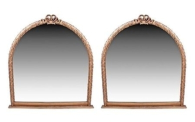 AN IMPRESSIVE PAIR OF GILT FRAMED ARCHED WALL MIRRORS THE FRAMED MOULDED