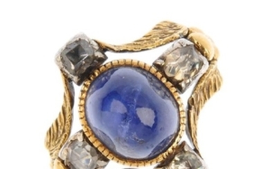 A sapphire and diamond dress ring. The oval sapphire