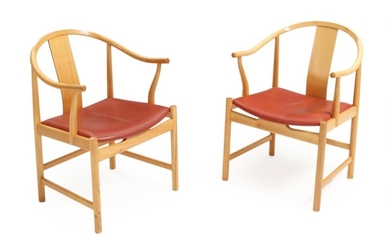 Hans J. Wegner: “Chinese Chair”. A pair of cherry wood armchairs, seats with red leather. Manufactured and stamped by PP Furniture, 1997. (2)