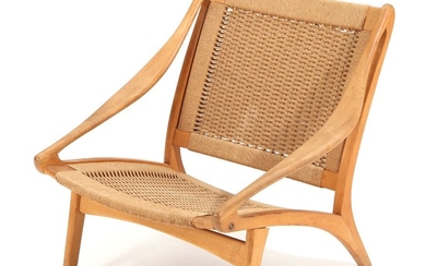 Illum Wikkelsø: Armchair with “knock-down” beech frame, covered with woven paper cort. Manufactured by N. Eilersen.
