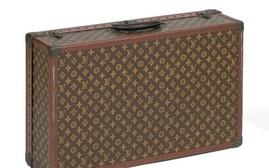 LOUIS VUITTON "ALZER" HARD-SIDED SUITCASE Exterior with allover LV monogram, leather handle, and brass hardware and lock. Interior f...