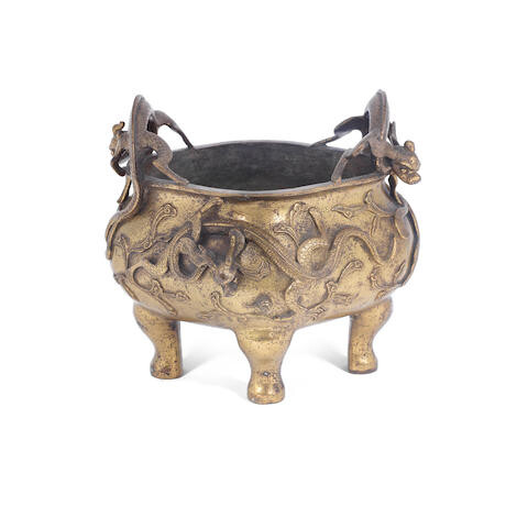 A gilt-bronze 'dragon' tripod incense burner