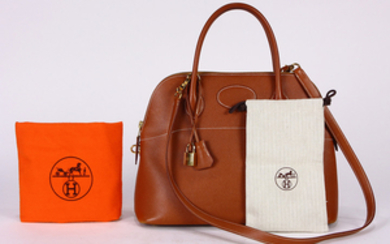 Hermes veau doblis bolide handbag, executed in tan, 31cm, with strap, lock, clochette, dust bag, rain jacket, and box; Provenance:...