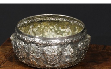 A 19th century Burmese silver circular bowl, repousse chased...