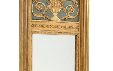 A 19th century Empire gilded, bronzed and painted wood mirror, richly decorated...