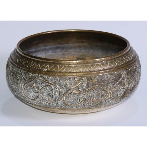 A 19th century Indian/Ceylonese bronze singing bowl, cast wi...