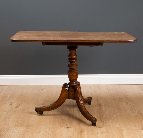 A 19th century mahogany tilt top tripod table