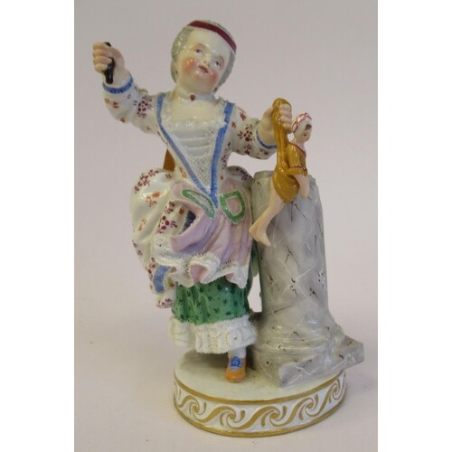 A 19thC Meissen porcelain figure, a girl holding a doll, bes...