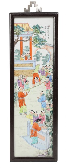 A 20th century Chinese porcelain plaque, decorated in enamel colours with playing children and poem. Visible size 74×21 cm.