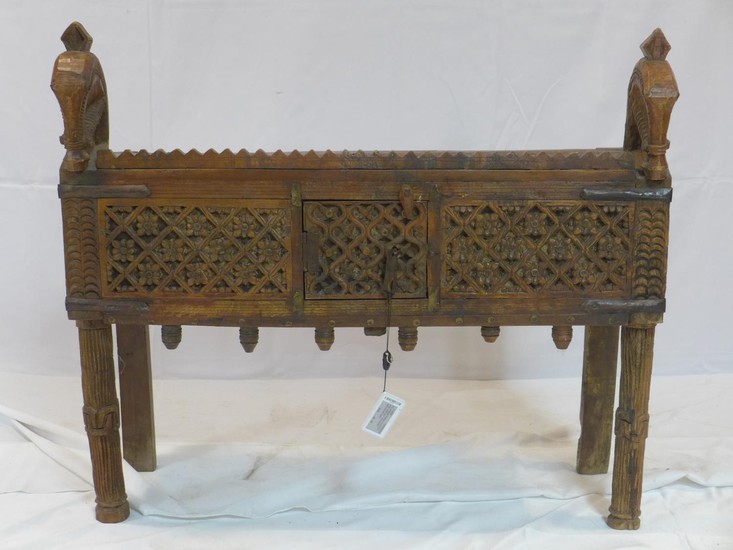 A 20th century Indonesian carved teak side cabinet with hors...