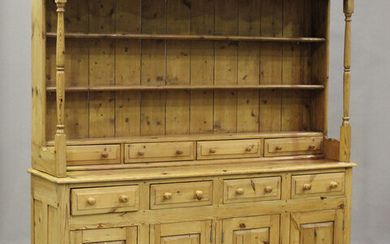 A 20th century pine dresser, the shelf back and base fitted with drawers, height 197cm, width 179cm