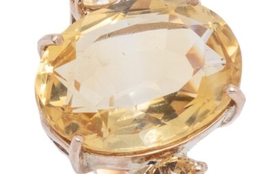 A 9CT GOLD CITRINE COCKTAIL RING; centring an approx. 6.5ct oval cut lemon citrine flanked by 2 round cut lemon citrine on each upsw...