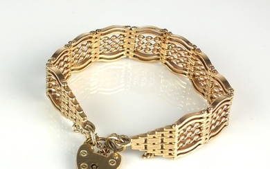 A 9ct gold fancy gate link bracelet, with heart shaped padlo...