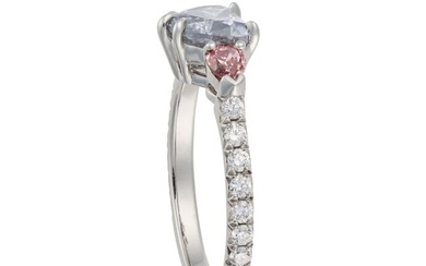 A BLUE AND PINK DIAMOND RING set with a heart cut blue diamond of approximately 0.97 carats betwe...