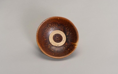 A BROWN GLAZED MOLDED BOWL