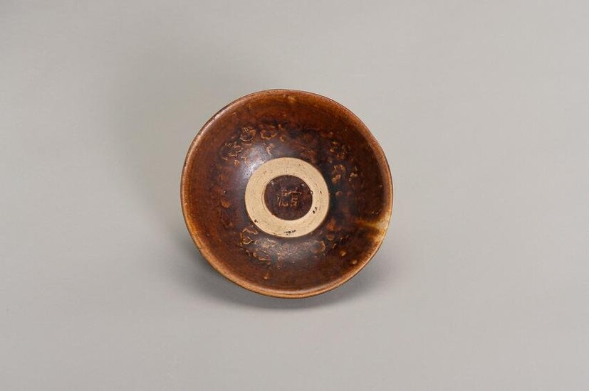 A BROWN GLAZED MOLDED BOWL