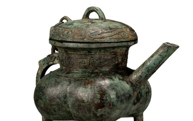 A CHINESE ARCHAISTIC BRONZE RITUAL EWER HE