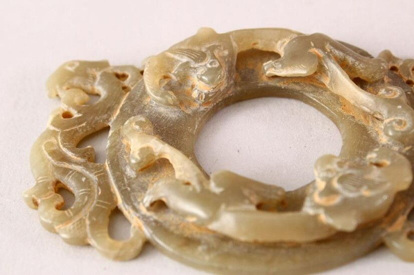 A CHINESE CARVED GREEN JADE CHILONG DISK / PENDANT