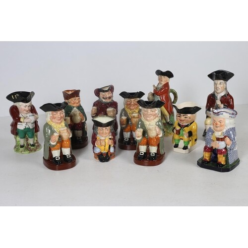 A COLLECTION OF ELEVEN TOBY JUGS to include six Royal Doulto...