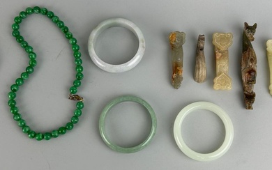 A COLLECTION OF FIVE CHINESE JADE OR STONE BANGLES...